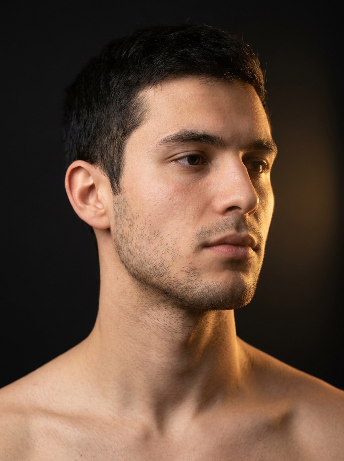Editorial portrait highlighting the masseter and temporalis muscles of the face